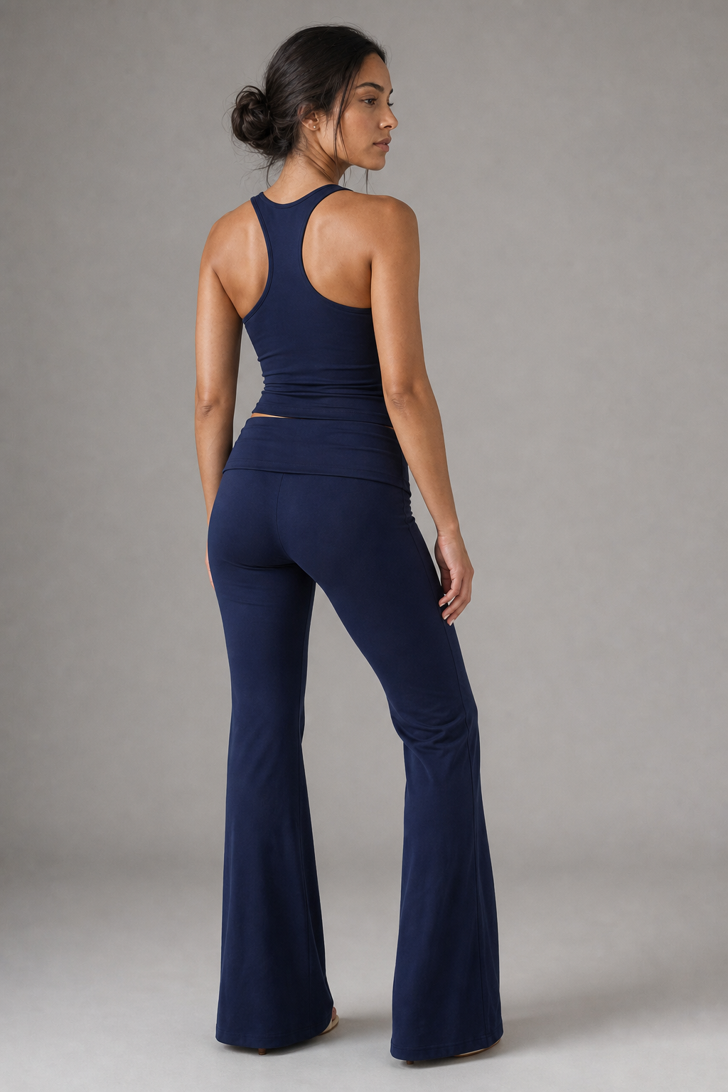 Back view fit of foldover flare Pilates pants
