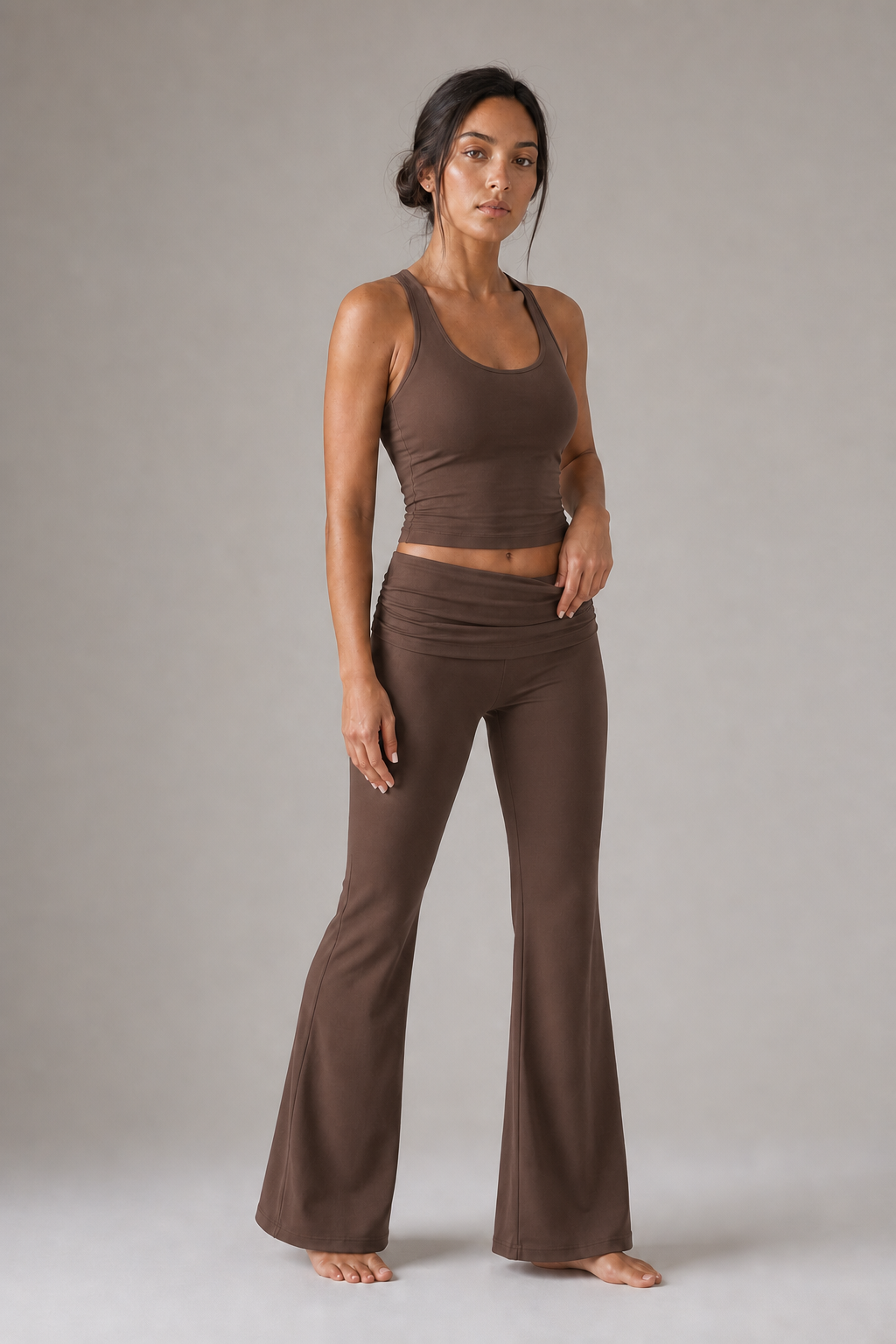 Mocha brown foldover flare Pilates pants on model