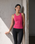 Front studio view of the Raspberry Red Contour Racer Tank in winter sun.