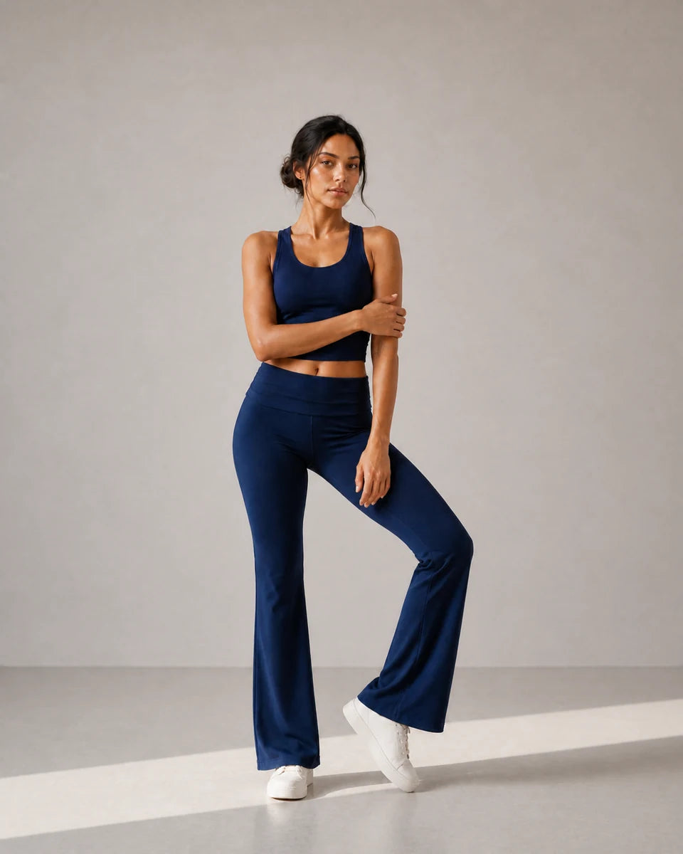 Model wearing Deep Navy Foldover Flare Pilates Pants in a sculptural front fit pose
