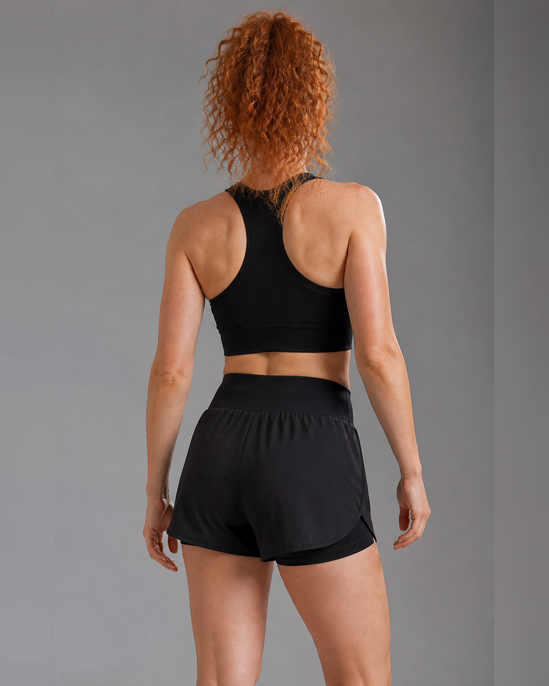Rear view of the black double-layer running shorts.