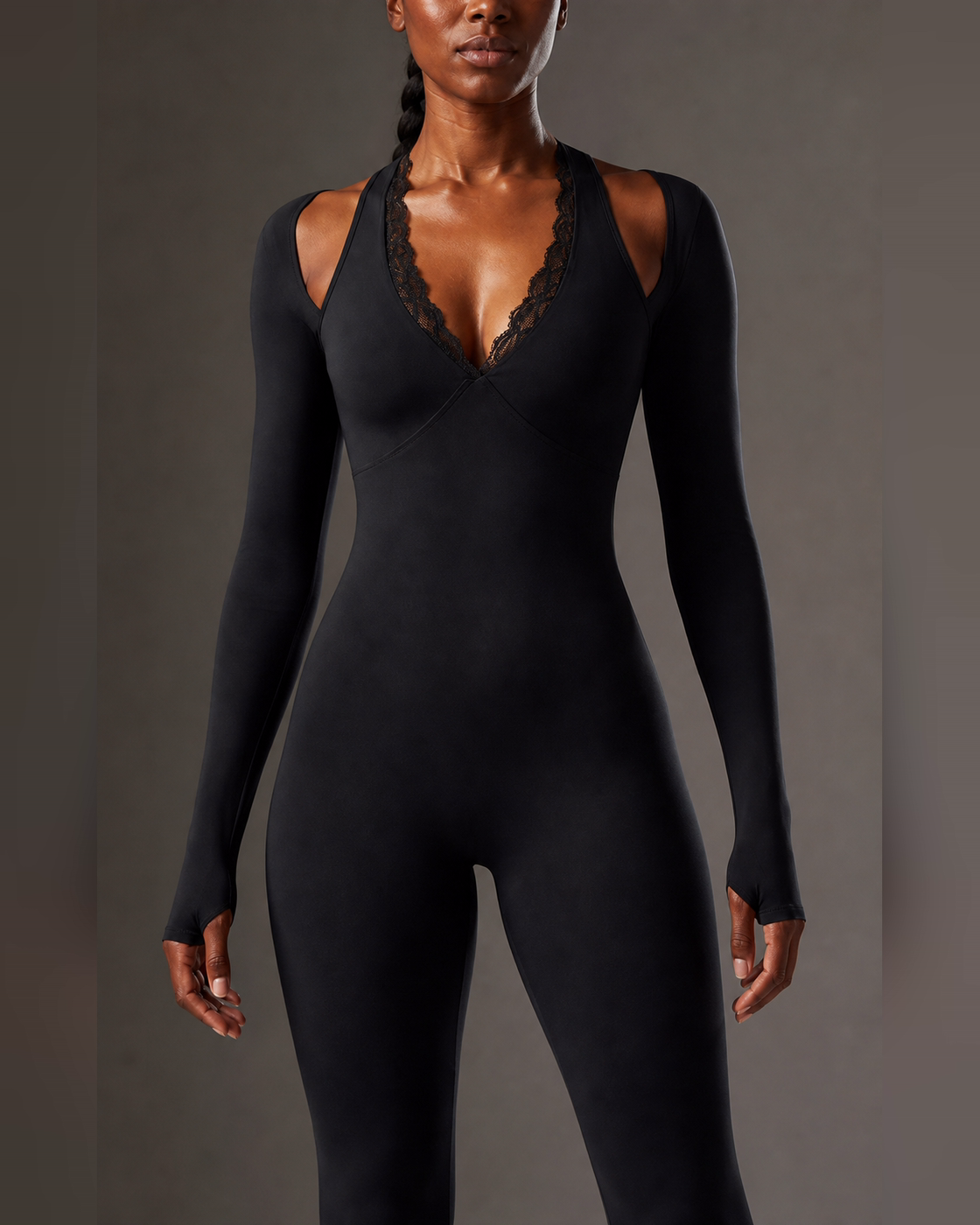 Close view of the lace trim and cutout construction in black.