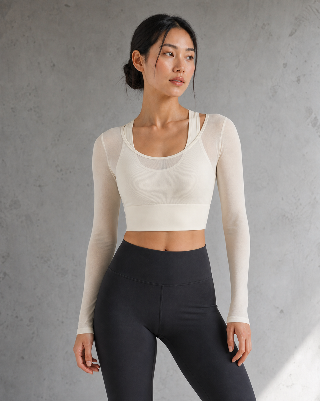 Model wearing an Ivory mesh-layer long-sleeve top in a daylight studio.