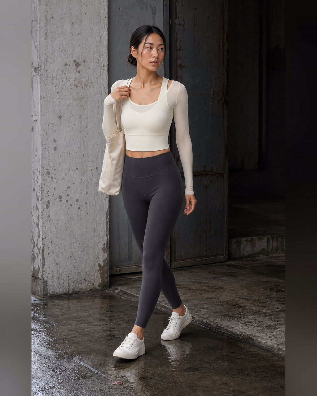 Ivory mesh-layer top styled at a worn studio threshold after rain.
