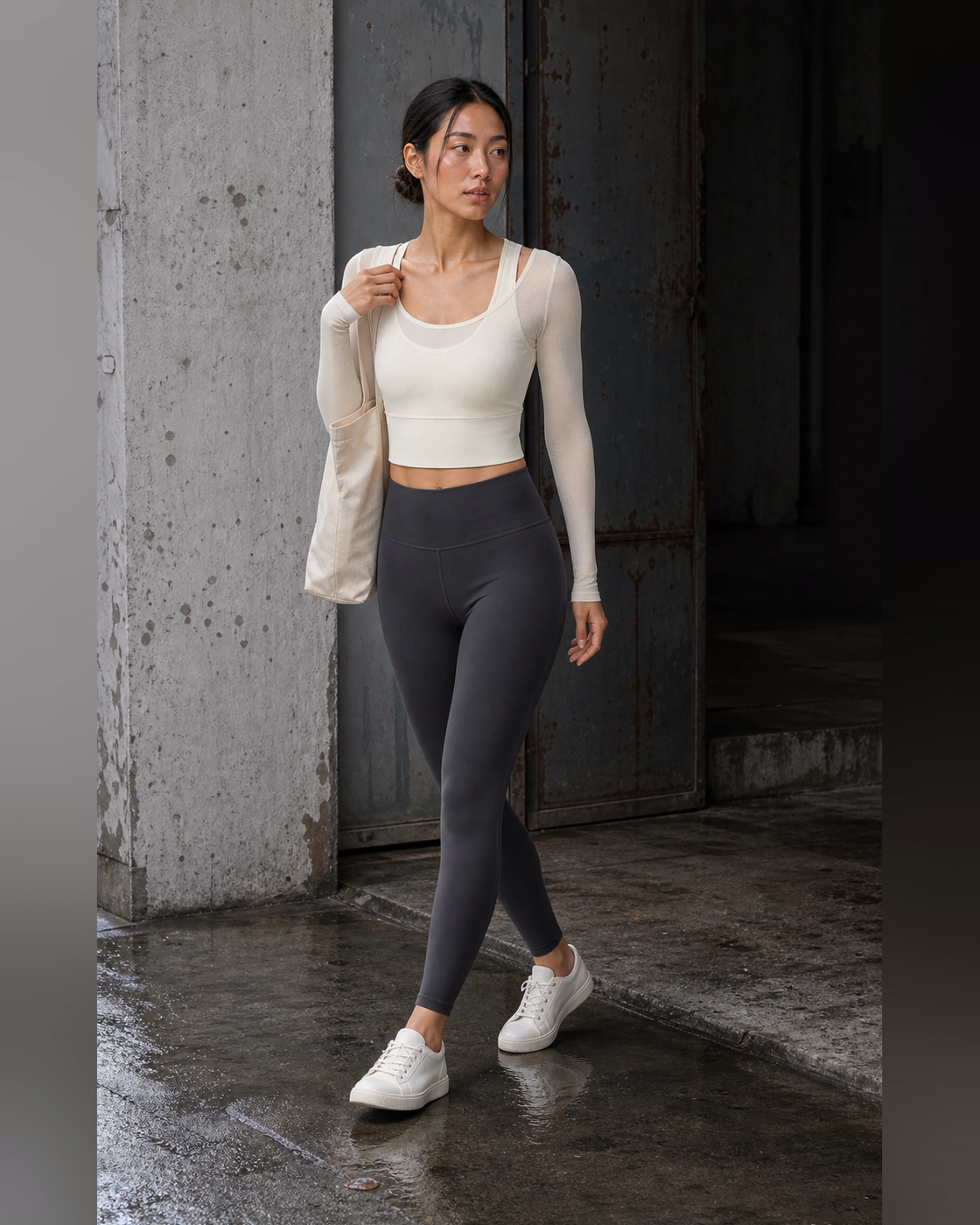 Ivory mesh-layer top styled at a worn studio threshold after rain.