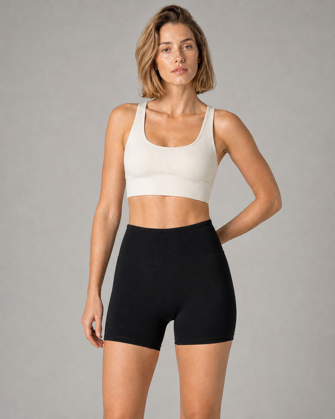 Front studio campaign view of the Black Ribbed Waist Studio Short
